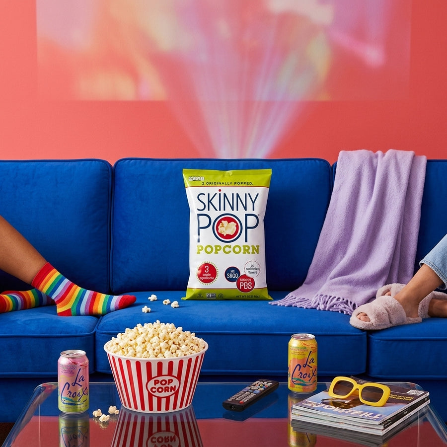 SkinnyPop popcorn in a colorful movie-night living room setting